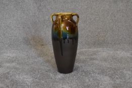 A Persian drip glazed vase with four handles. H.30cm