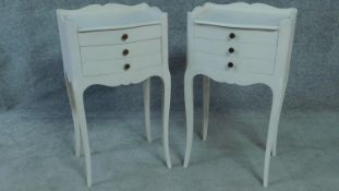 A pair of white painted French provincial style bedside chests on cabriole supports. H.67 W.37 D.