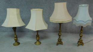 A pair of gilt Rococo style table lamps and another similar pair. H.111cm