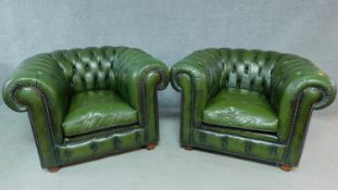 A pair of Chesterfield armchairs in buttoned green leather upholstery. H.76 W.110 D.96cm