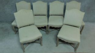 A set of six French provincial style oak framed dining chairs in calico upholstery. H.95cm