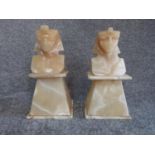 A pair of vintage carved alabaster pharoah head statues on plinths. H 27