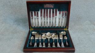 A wooden cased canteen of silver plated cutlery by Elkington and Co of Sheffield. W.41 D.30cm