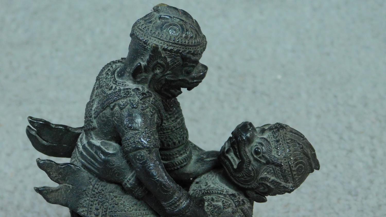 A Thai bronze statue of two Thai monkey gods fighting on a abstract design pedestal base. - Image 2 of 5