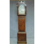 A 19th century oak cased longcase clock with painted arched dial. H.213cm