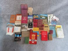 A collection of worldwide vintage maps, guides, postcards and other travel ephemera collected by