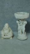 A painted concrete birdbath and seated buddah. Birdbath with three cherubs holding an urn. H.54 (