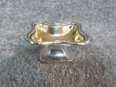 A gilded Austrian silver salt dish, with monogram and Austrian hallmarks and makers mark. H 8 x 4.5.