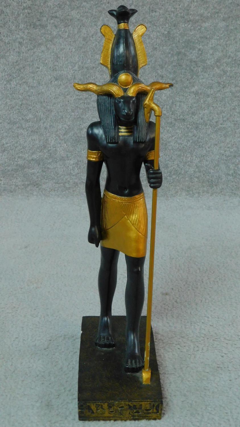 A moulded statue of the Egyptian god Khnum in black and gold with hieroglyphs around the base. H. - Image 2 of 5