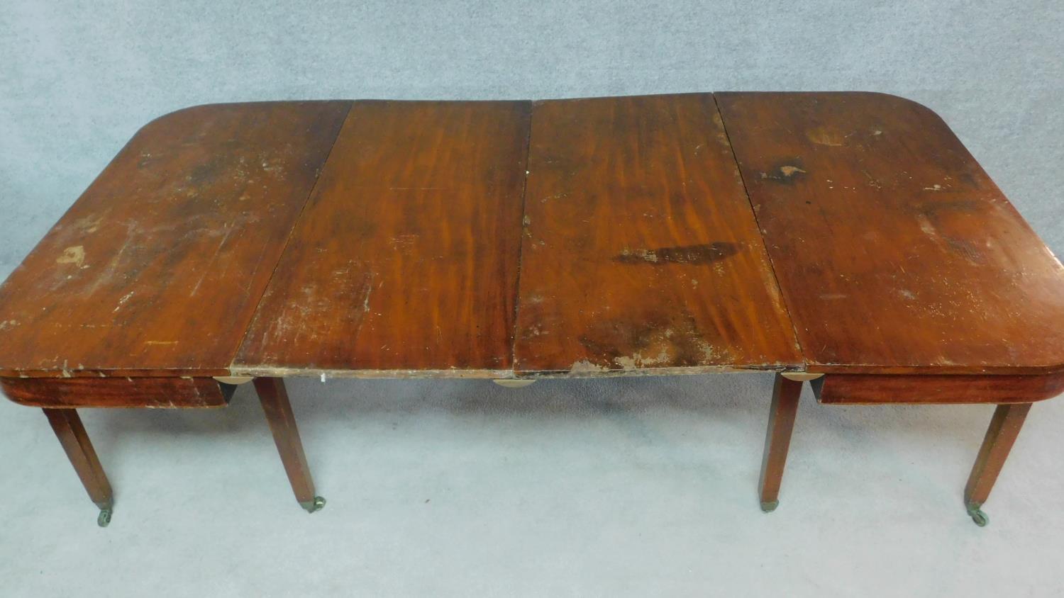 A Georgian mahogany D end dining table with two extra leaves. H.75 W.233 D.125cm - Image 2 of 12