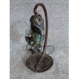 A vintage cast bronze stingray and slag glass mosaic fish desk lamp. H 38.5 cm.