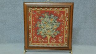 A wooden framed tapestry fire screen. H.66 W.60cm