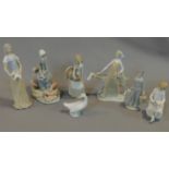 Seven figures by Lladro, Tengra and Nao: Lady holding a dove, milkmaid with pigs, girl holding a