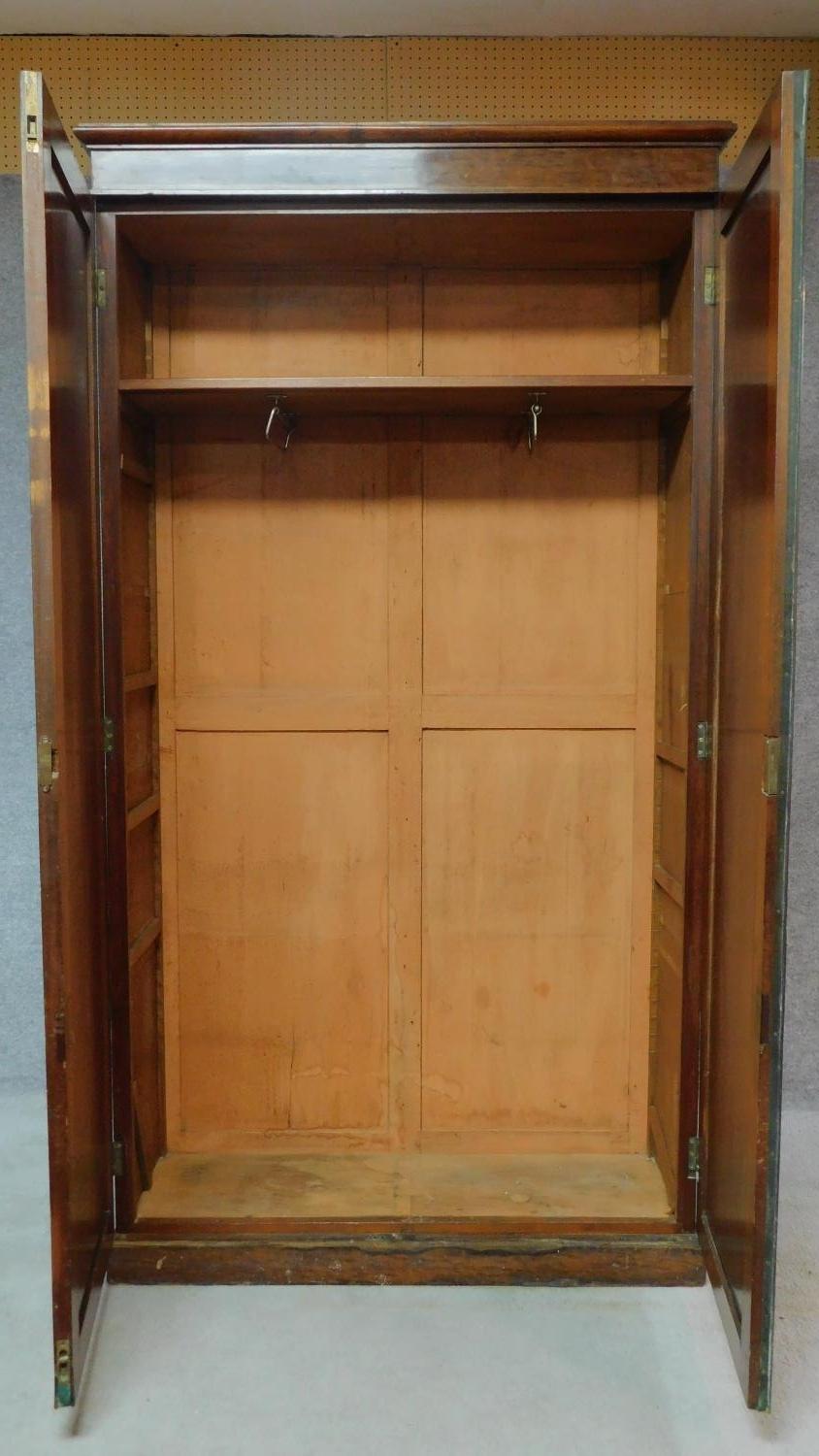 An early 19th century plum pudding mahogany hall cupboard fitted with panel doors enclosing - Image 2 of 10