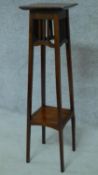 A late Victorian mahogany torchere on square tapering supports. H.99cm