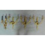 A set of three ormolu Rococo style two branch wall lights and another similar. H.41 D.37cm