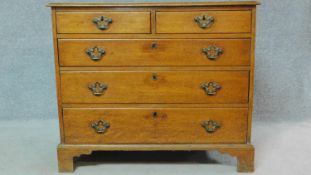 A Georgian country oak chest of two short over three long drawers on bracket feet. H.80 W.94 D.47cm