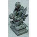 A Thai bronze statue of two Thai monkey gods fighting on a abstract design pedestal base.