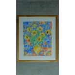 A framed and glazed watercolour by Tania Short depicting a still life of a jug of sunflowers,