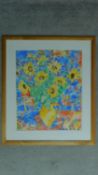 A framed and glazed watercolour by Tania Short depicting a still life of a jug of sunflowers,