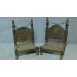 A pair of antique Afghanistan wedding praying stools with intricate allover carving. H.77cm