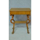 A 19th century Continental satin birch lamp table on carved paw feet. H.69 W.56 D.37cm