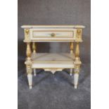 A pair of cream and gilt bedside tables fitted frieze drawer and turned and ornately carved legs