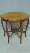 A late Victorian shaped top occasional table on six cabriole supports united by undertier. H.73 W.75