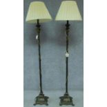A pair of classical style metal standard lamps. H.160cm