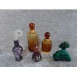Five glass scent bottles. One by Blowzone, Visage designed by Iestyn Davis with an abstract face,