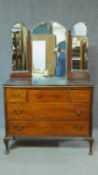 An Edwardian mahogany dressing table with triple mirror back. H.150 W.101 D.46cm (central mirror