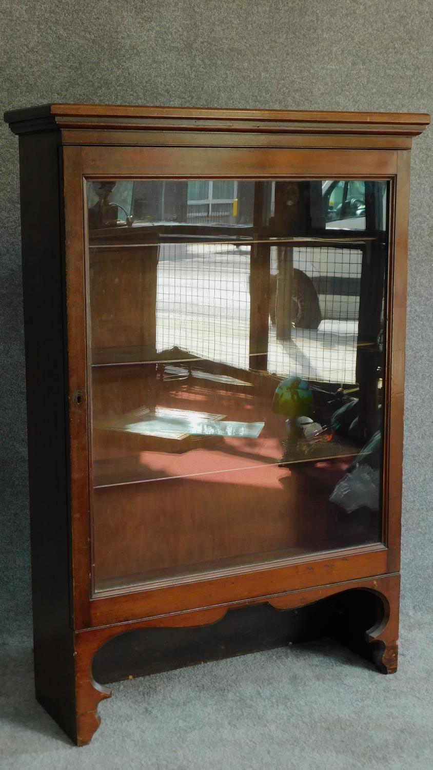 A 19th century mahogany glazed single door bookcase on shaped bracket feet. H.123 W.82 D.28cm - Image 2 of 5