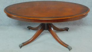 A Regency style mahogany low table raised on turned swept legs on casters. H.54 W.125 D.72cm