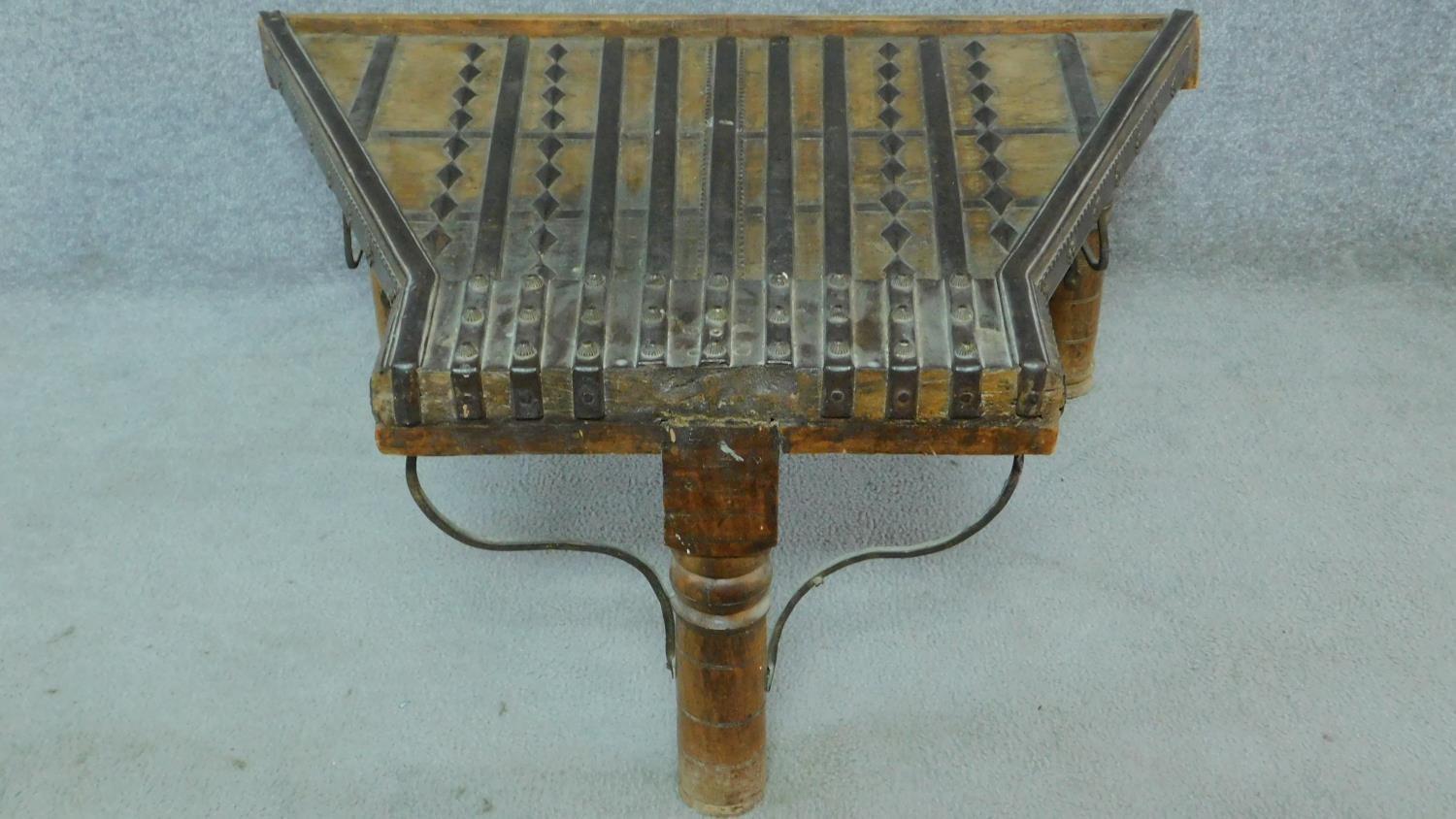 An antique Indian hardwood shaped top low table with brass studding and binding. H.38 W.87 D.64cm - Image 2 of 5