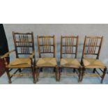 A set of four 19th century elm Lancashire spindle back dining chairs, one chair with arms. H.103cm
