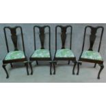 A set of four early 20th century mahogany Queen Anne style dining chairs on cabriole supports. H.
