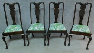 A set of four early 20th century mahogany Queen Anne style dining chairs on cabriole supports. H.