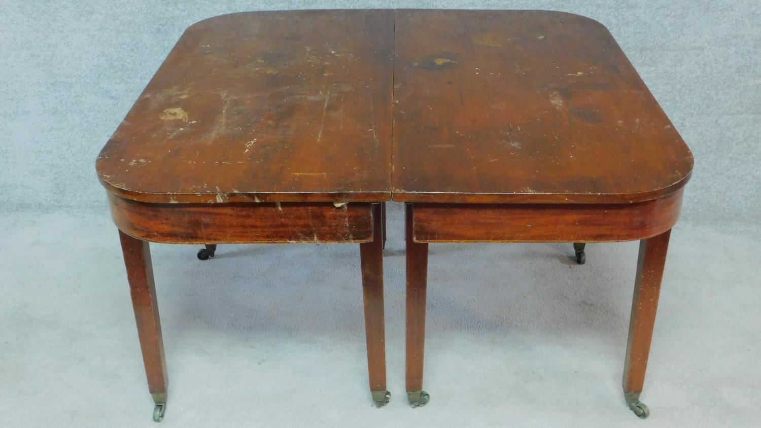 A Georgian mahogany D end dining table with two extra leaves. H.75 W.233 D.125cm - Image 9 of 12