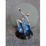 An Art Deco porcelain hand painted dancer lamp with original frosted glass circular plate. H32