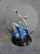 An Art Deco porcelain hand painted dancer lamp with original frosted glass circular plate. H32