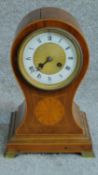 A late 19th century French balloon shaped mantel clock in mahogany and satinwood case. H.30 W.20 D.