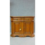 A French provincial style burr elm side cabinet fitted with cupboards and frieze drawers. H.86 W.102