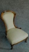 A Victorian walnut and ebony framed inlaid nursing chair H.87cm