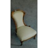 A Victorian walnut and ebony framed inlaid nursing chair H.87cm