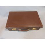A Mappin & Webb brown leather travelling case, pale suede interior, brass clip locks, Mappin &