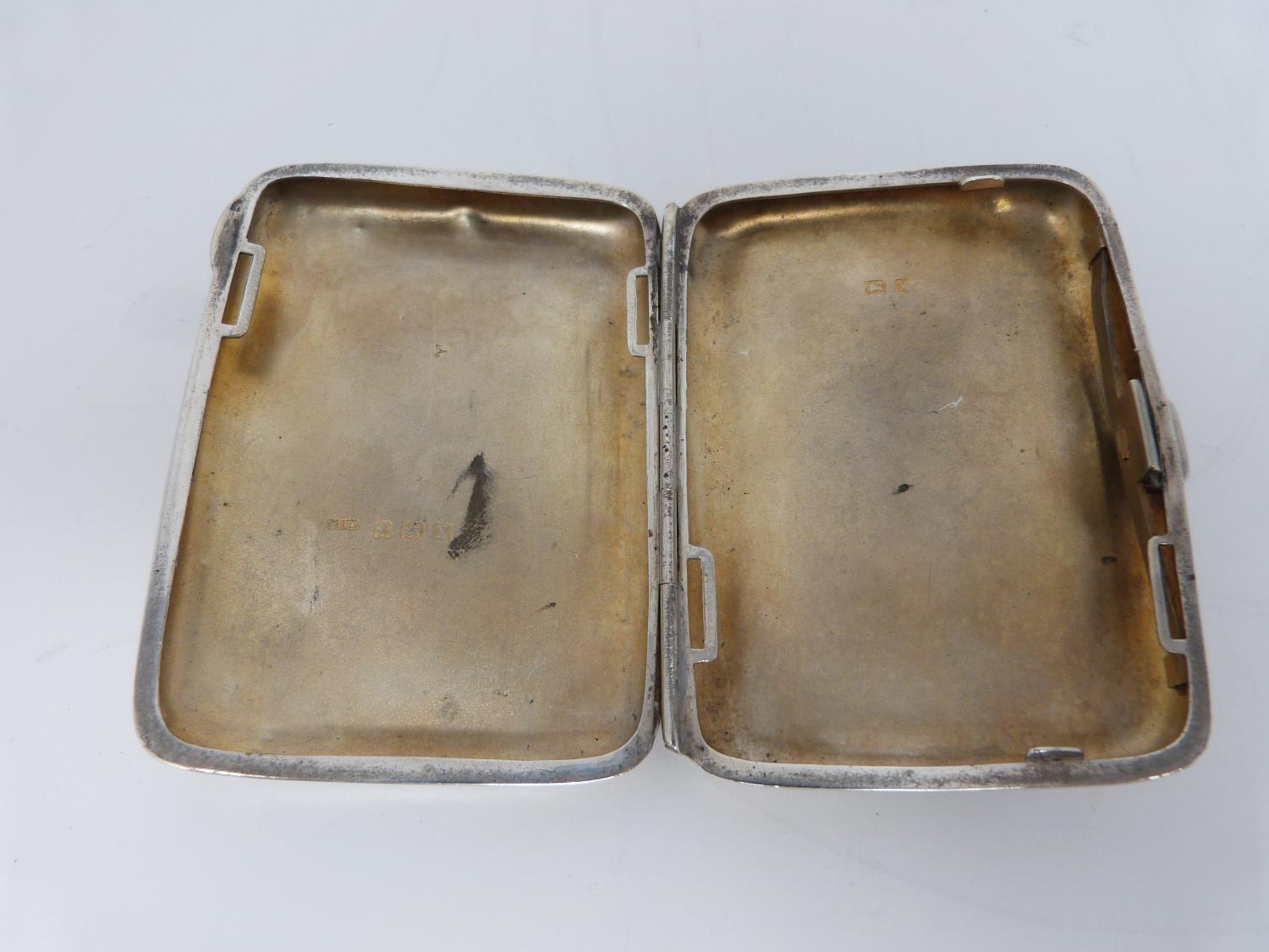 Two silver cigarette cases, the smaller with stylised foliate decoration and central shield - Image 10 of 12