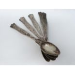 Five continental white metal spoon with engraved details. (199g).