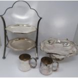 A silver plated cake stand, handled basket and two tankards, basket stamped EPNS, 13694, flower form