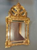 An antique Florentine gesso and carved giltwood wall mirror with original plates. H72.5