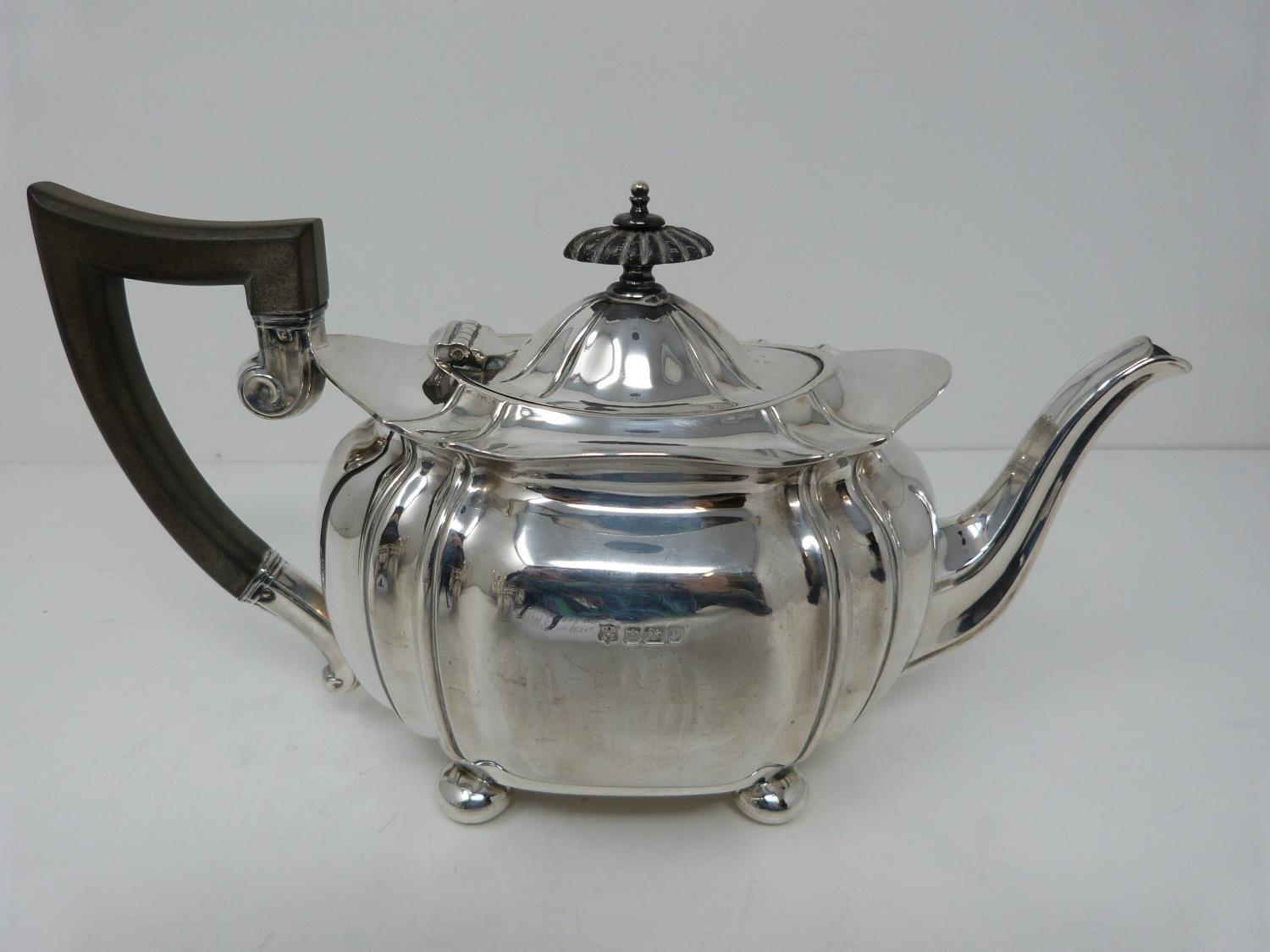 An Edwardian silver tea pot, hallmarked: CB&S or Cooper Brothers and Sons, Sheffield, 1907. Four